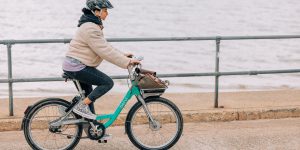 Customer on a Beryl Bike along seafront