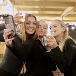 Three girls taking selfie at bottomless brunch