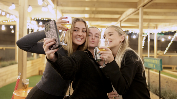 Three girls taking selfie at bottomless brunch