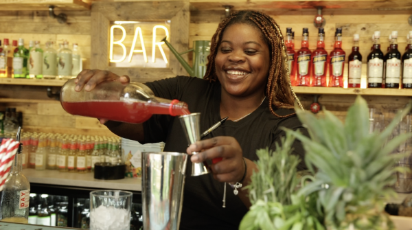 Barmaid making cocktails