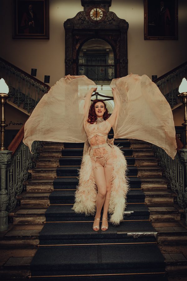 Big Band Burlesque dancer on stairs